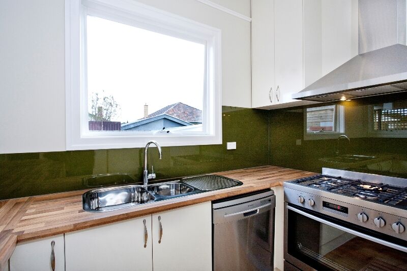 Kitchen with Butherblock benchtops, and Stainless steel appliances