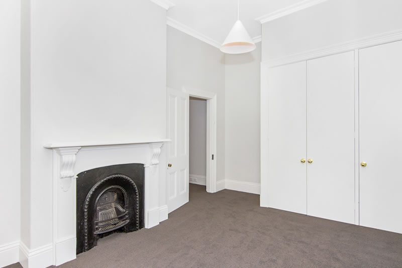 Fireplace in sleek bedroom